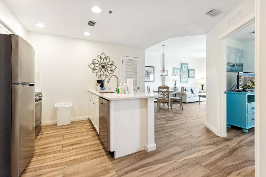 This fully furnished, beachside getaway offers breathtaking Eastern 180 views from the covered balcony, spanning the beach to the bay. Stylish porcelain plank tile flooring flows throughout, complementing the updated kitchen with painted white cabinets, white quartz counters, and stainless steel appliances.The full bath, accessible from both the bedroom and foyer, features a new white vanity. The spacious bedroom offers a king sized bed and two closets, one as a locked owner's storage. A new HVAC (2022) ensures comfort year-round. For those seeking fun in the sun, the private complex pool awaits, adorned with loungers, a grotto waterfall, and a seasonal Tiki Bar offering food and an array of refreshing libations and frozen cocktails. Across the street is the Sandestin public beach! As an introduction to the Sandestin lifestyle, we invite our new owners to explore amenities that make Sandestin special. The listing brokerage and seller(s) are presenting the buyer(s) of this property with (2) 90-minute rounds of Tennis court time, a golf foursome at one of our three championship courses, and a round of golf for up to four (4) players at the unrivaled Burnt Pine Golf Club.

Sandestin Golf and Beach Resort features more than seven miles of beaches and pristine bay front, four championship golf courses, 15 world-class tennis courts, a 226-slip marina, a fitness center, spa and celebrity chef dining. Shop, dine and play at the charming pedestrian village, The Village of Baytowne Wharf and more. Inside the gates of the resort, residents enjoy a balanced lifestyle of high-class living, spanning the 2,400 acres from the beach to the bay. Everything within the gates of the resort is accessible by golf cart or bicycle. The entire resort is interconnected by miles of pedestrian, bike and golf cart paths that weave through groves of live oaks, meandering past natural lagoons, fountains, man-made lakes, and meticulously landscaped fairways.
