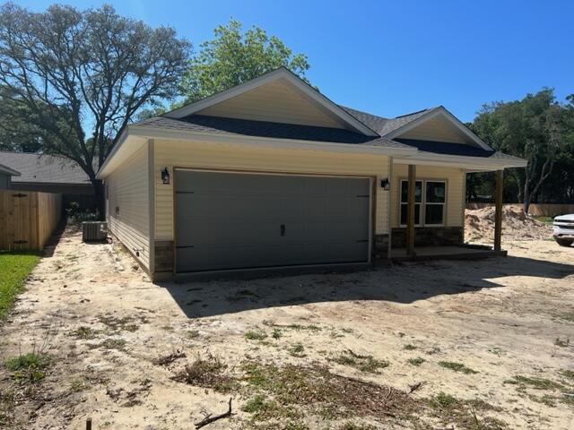 New Construction - features architecturally distinct gables with the classic front porch. The interior has beautiful finishing touches including LVP flooring throughout, nine foot ceilings with a tray in the master and living area. Open kitchen with custom white shaker style cabinets with easy close doors, granite counter-tops, stainless steel LG appliances including refrigerator. The dining room leads to the covered back porch grilling area. Both bathrooms have granite countertops and master has large walk in closet. This is a Good Sense energy efficient home with Low E windows and Rheem HVAC. Home includes privacy fence with gates on both sides.