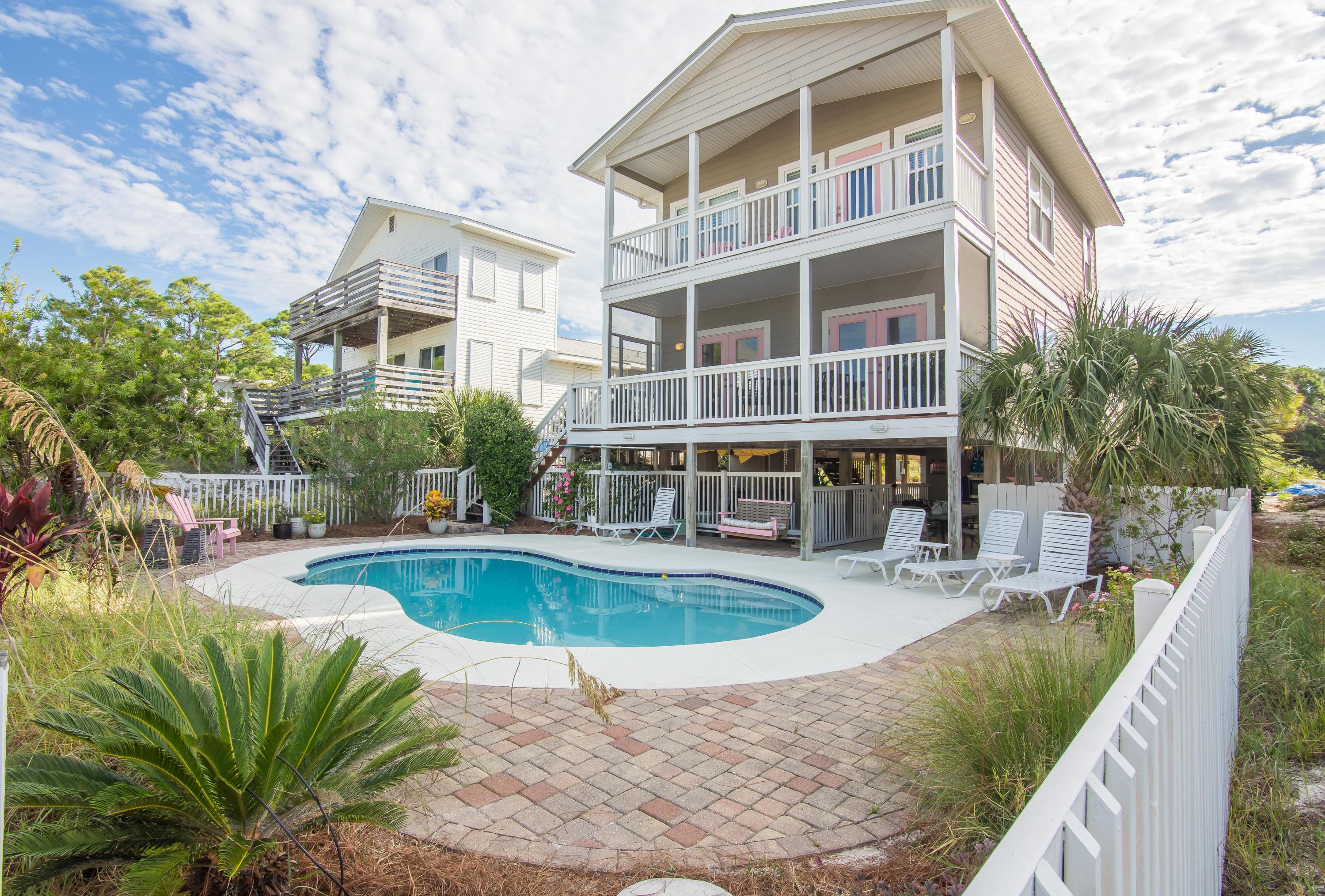 This quintessential Florida beach house is situated with a gulf-view in historic Grayton Beach. The updated 4 bedroom, 3-1/2 bath home is just steps from one of the world's most beautiful beaches and priced to sell! In old town' Grayton Beach, where the locals embrace the easygoing lifestyle, you will not want to miss a single sunset from any of this home's three covered lanais. Featuring a meticulously maintained exterior, this home's main level offers a large custom pool, outdoor shower, half bath, and covered terrace. Additional outdoor features include natural, low maintenance landscaping, customized work space, convenient storage areas, covered parking and generator. On the second level, opening to a spacious living room with copious windows and doors letting in abundant natural light, this home welcomes you to an open concept floor plan that makes it a perfect spot for entertaining. The kitchen and dining room areas feature custom white cabinetry, stainless steel appliances, including a 6-burner gas range and dual oven, a breakfast bar and pantry! On this level you will find 3 guest rooms, two full bathrooms, as well as, a screen porch off of the living room. On the third level of this beautiful beach house, you can find a spacious Master bedroom with expansive walk-in closet and spectacular gulf-views. The Master bathroom features a large walk in shower, jetted garden tub, and dual vanities. Off of the Master bedroom you can enjoy gulf-views from the covered veranda. Don't miss out on this rare opportunity to own your own piece of paradise in the much sought after historical neighborhood of Grayton Beach.