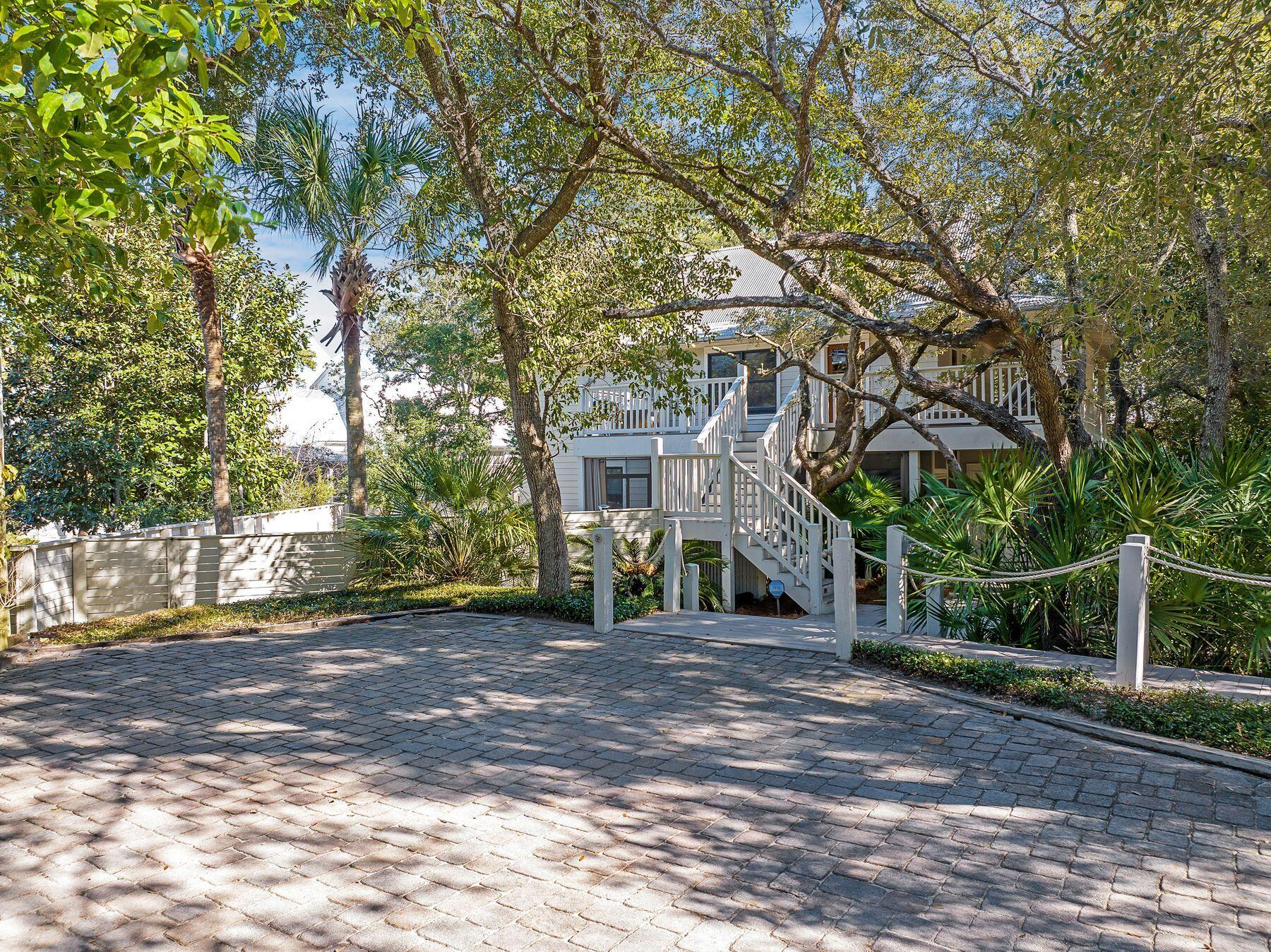 Welcome to Old Seagrove Beach and an estate sized lot of over 12,000 square feet with a 3 bedroom and 1 bunk room 2 bath cottage of 2,100 square feet with a great pool. Presenting the largest street frontage of any lot on Forest Street and indeed in Old Seagrove.   The current home sits stately and westerly on the lot leaving a sizable 46 foot by 125 foot remaining yard to the east for your imagination.Opportunities for expansion abound including additional space or even a pickle ball court while you enjoy an elegant living area with a charming ceiling treatment that brings warmth to the space on the second level.Overlooking the pool and yard is a stunning wrap around deck. A bedroom and kitchen along with a large living and dining room area in an open concept space completes the level. 

On the first floor is a living room so that the kids can have their own space. Complete with two bedrooms and a bunk room, there is room for any family.

The pool area and yard creates a playground for everyone. Imagine the easy walk to the substantial public beaches of Old Seagrove that is the hallmark of the charm of Florida along with an easy walk to the Seaside town center for entertainment just as close as the beach.  Enjoy nearby trails, the farmer's market and playtime in the Amphitheater as you create cherished memories like so many families.

216 Forest Street is an opportunity to own a masterpiece lot and a great cottage home on what is among the largest of all homes sites in all of Old Seagrove for $2,450,000