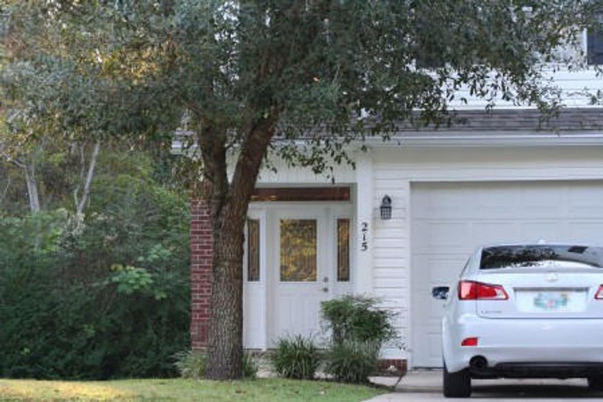 Enter this very nice town home into an open foyer accented by twenty foot ceilings and lighted by a hanging chandelier. The stairway leads to three bedrooms with nine foot ceilings, two full baths, and a laundry center upstairs. Master bedroom is equipped with a large walk in closet. Master bath features a jetted garden tub, separate his and hers vanities, and a shower. The downstairs is an open great room with high ceilings and fireplace. The kitchen features a breakfast bar, an open view of the living and dining areas, all appliances, and hard surface counter tops. Crown molding accents the living room, kitchen, master bedroom, and master bathroom.