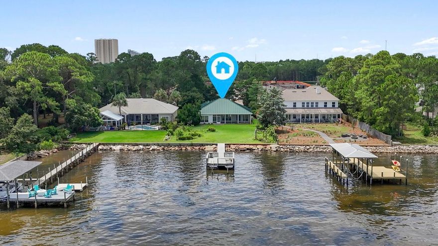 Waterfront Living in Miramar Beach - No HOA & Endless Potential! Bring your golf cart and discover the rare opportunity to own a bayfront home in the heart of Miramar Beach with 78 feet of private Choctawhatchee Bay frontage and a private dock! This location is perfect for boating, paddleboarding, fishing, or simply soaking in the serene bay views where the sunrise and sunset will take your breath away and watching dolphins play never gets old! Situated on a generous 0.51-acre lot, this single-story, 3-bedroom, 2-bathroom home offers 2,122 square feet of living space and the chance to transform it into your dream coastal retreat. Built in 1995, the home features a spacious split floor plan layout, a metal roof, a long paver driveway with additional parking, and a 2-car garage - all tucked away on a dead end street with no HOA restrictions and golf cart/LSV accessible to the beach! Inside you'll find a great layout with incredible views that's ready for your personal touch and updates. The lot provides ample space for outdoor living additions like a pool, fire pit, or expanded patio overlooking the bay. Located walking distance from Legion Park, which is slated for exciting new renovations and amenities to start at the end of 2025, this property is close to shopping, dining, and the sugar-white beaches that make Miramar Beach a destination favorite. Whether you're looking for a primary residence, vacation home, or investment with future potential, this bayfront gem offers the perfect canvas.