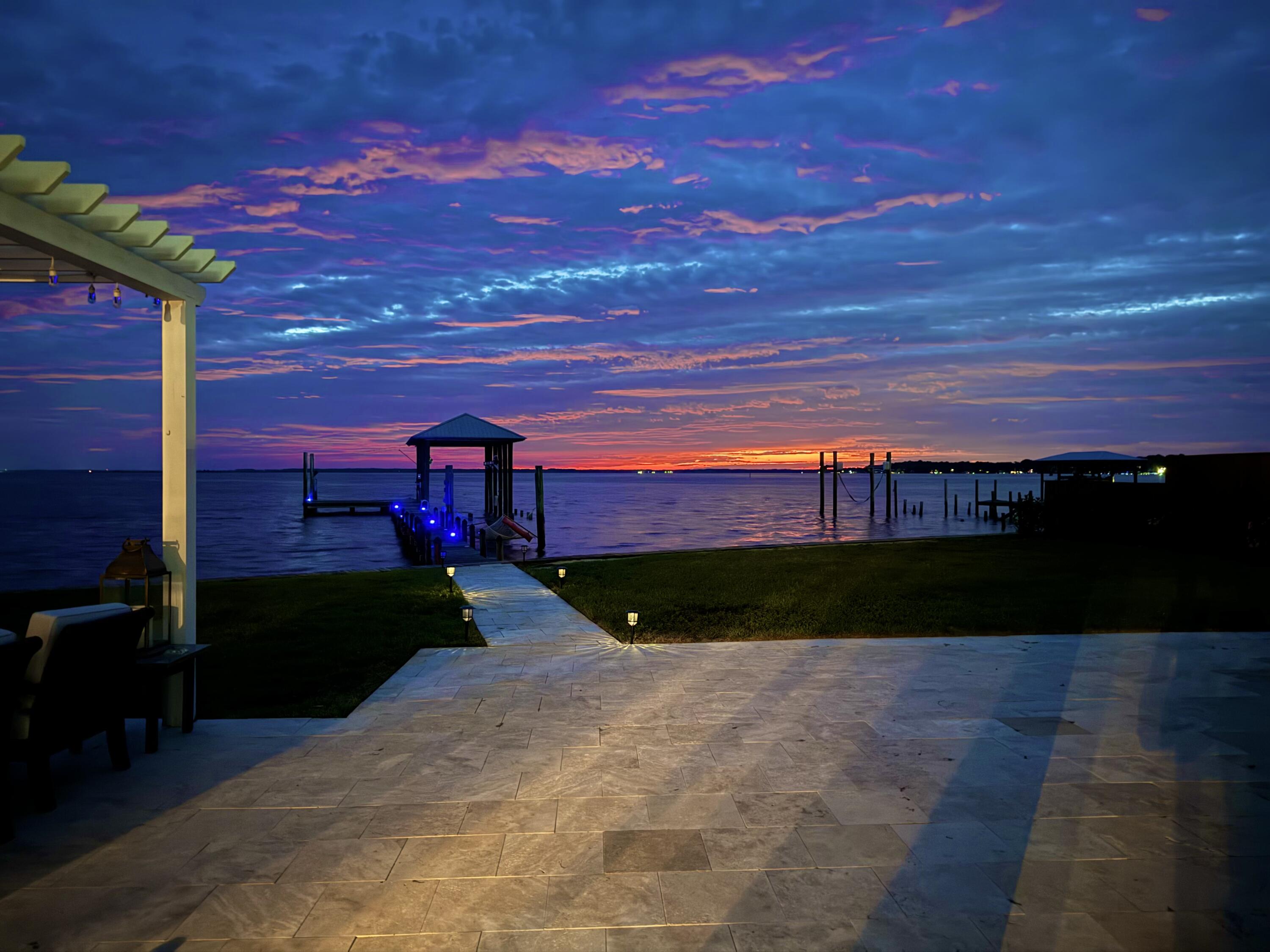 Welcome to your dream Florida lifestyle! This stunning New Orleans-style home offers breathtaking bay views and unforgettable experiences, all just a 10-minute drive from the pristine, white sandy shores of the Emerald Coast.Start your day with picturesque sunrises, watch dolphins visit multiple times a day, and take advantage of your private boathouse with lift, granting you access to over 30 waterfront restaurants. Fishing enthusiasts will love having a variety of species right in your backyard, including Redfish, Spotted Trout, Black Drum, Mangrove Snapper and more. Conveniently located just minutes from Sacred Heart Hospital, the South Walton Fire Department, and the vibrant Grand Boulevard. Keep an eye out for majestic osprey, bald eagles, and pelicans soaring overhead! In the evenings, unwind in your outdoor kitchen or heated pool, soaking in the pastel skies. Experience the ultimate in coastal living today!