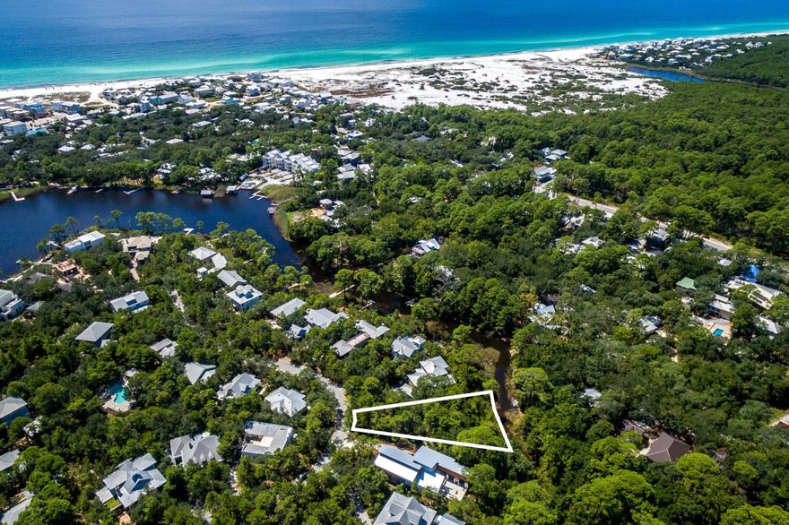 Away from it all, in the heart of it all is how you feel when you're behind the gates of The Lakeplace at Grayton Beach. This rental restricted coastal dune lake community is comprised of just 49 homesites on the south side of 30A, steps away from Lakeplace's dock on Western Lake & all of the restaurants and shops in the historic Village of Grayton Beach. At ⅓ of an acre Lot 29 is the largest available & offers a beautiful wooded canvas to build your private paradise in the heart 30A. Proposed renderings & floor plan for a single story, 2,057 sqft residence with 3 bedrooms & 3.5 baths are available from a community-approved architect. The plans include a private courtyard & over 350 sqft of outdoor space to take in picture-perfect sunsets just steps away from all of the action 30A.
