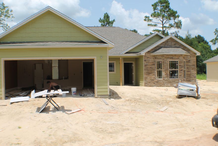 Location Location Location! Walk to CHS,Davidson ,banks ,Movies, Restruants and Winn Dixie! New Home Large lot ! 3 Bedroom, 2 Bath home with many upgrades! Granite counter tops in both the kitchen and bathrooms. Cathedral ceilings with wood cielings. Laminate wood floors,tile in the bathrooms! Hard plank siding shaker gables! Tile shower with claw tub in the master bathroom! Under construction. Come home today! Local custom builder. See documents section for floor plan!