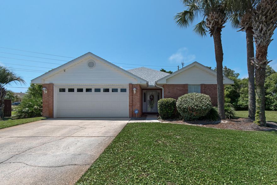 Walk to the beach, short term rentals are allowed in this low density community just 1 block from a Regional Access with 380+ feet of beach. This all brick ranch features a new roof in 2020. Substantial updates in 2022 include full interior repaint, LPV flooring, kitchen cabinets, quartz tops, stainless appliances and lighting fixtures.  Open living area filled with natural light and a vaulted ceiling with a fireplace.  Large master suite, master bath has a walk in shower, soaking tub, two additional bedrooms share a hallway bath. Community pool at the end of street and low HOA fees of $860.00 per year.There is a deeded access for owners across from the Embassy Suites hotel. PUBLIC BEACH ACCESS WITH PARKING AND RESTROOMS IS TO THE WEST 1 BLOCK IN FRONT OF AMALFI COAST CONDOS.
