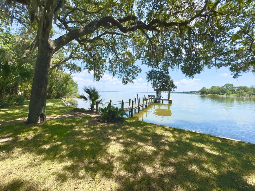 Looking for an exquisite All-Brick home situated on a premium 3/4 Acre Private lot on the Bay? Here it is! This property also includes a detached 2-car garage w/studio/guest room/workshop built in 2018. It is heated and cooled with a full bath & 2 automatic garage doors - perfect for a business owner, car enthusiast, artist, you name it! The garage doors have automatic screens that roll down so you can enjoy the breeze flowing without the pesky bugs. The views are breathtaking, the home is solidly built all-brick w/hip roof (new in 2021); Dual A/C units, whole house & building Generac generator. 4 bedrooms with primary suite on the main level. Bedroom #2 has en suite bathroom and doors directly to the screened porch and back yard to take in the morning sunrise and evening sunset.