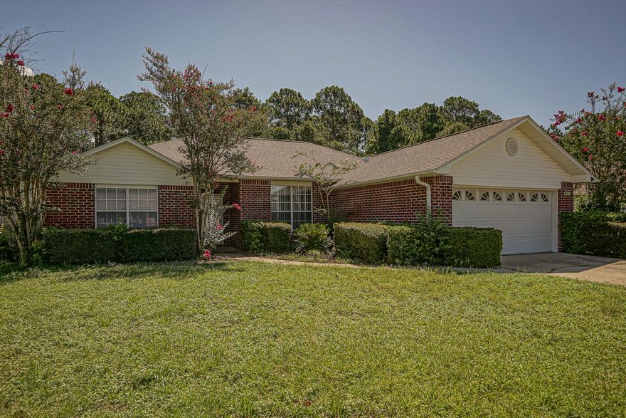 Welcome to your ALL BRICK home just minutes from the beach. New roof for a lower insurance rate. New flooring, paint; A/C just serviced and a new stove coming. Island in the kitchen for creating those special dinners. Split floor plan. Master has double vanity and  garden tub. Exterior has new solar powered flood lights at each corner and gutters. Lush yard has a sprinkler system and pump. Home inspection done, upgraded home warranty; seller to assist with closing costs for peace of mind. Nestled in a small subdivision w/no through traffic and close to main roads. The spacious screen enclosure still leaves room for a pool and outdoor kitchen for entertaining. Backyard backs up to mature trees and lovely vegetation; added privacy. All the work has been done;WELCOME HOME(more photos to come)
