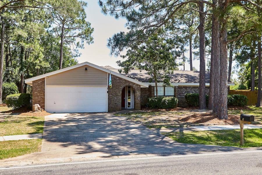 Gorgeous home in the much sought after Indian Bayou neighborhood that holds the Indian Bayou Golf Club. Sitting on a large quiet corner lot with a privacy fenced back yard and pool, the entire back patio has been upgraded and beautifully paved around the large pool with a COMMERCIAL pool heater and outdoor shower. The home has the ideal split floor pan with large bedrooms and a spacious hall bath room . In the Master Suite there are 2 closets, one being a large 8x5 walk in and patio doors leading to the back patio. The kitchen overlooks the gorgeous outdoor retreat and has stainless steel appliances, plenty of counter space and a breakfast bar. The family room, living room, and dining area have all been updated with wood plank tile and have vaulted ceilings.