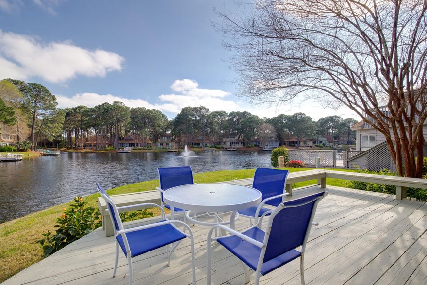 Nestled beside a serene lake, this coastal cottage offers a tranquil location with the convenience of resort amenities. With two bedrooms, two baths, generous living space and stylish finishes, you'll enjoy the perfect setting for relaxing and entertaining. The expansive outdoor space beckons for lounging on the deck while watching the ducks swim by. Natural light is abundant in the living and dining rooms which are accented by low maintenance tile flooring. Serenity may be found in the master bedroom with the peaceful backdrop of lake views. Prepare a meal in the tasteful kitchen with granite countertops then enjoy a picnic on your private screened porch while enjoying the sounds of nature. The guest bedroom, with ensuite bath featuring a walk-in shower, is the perfect retreat