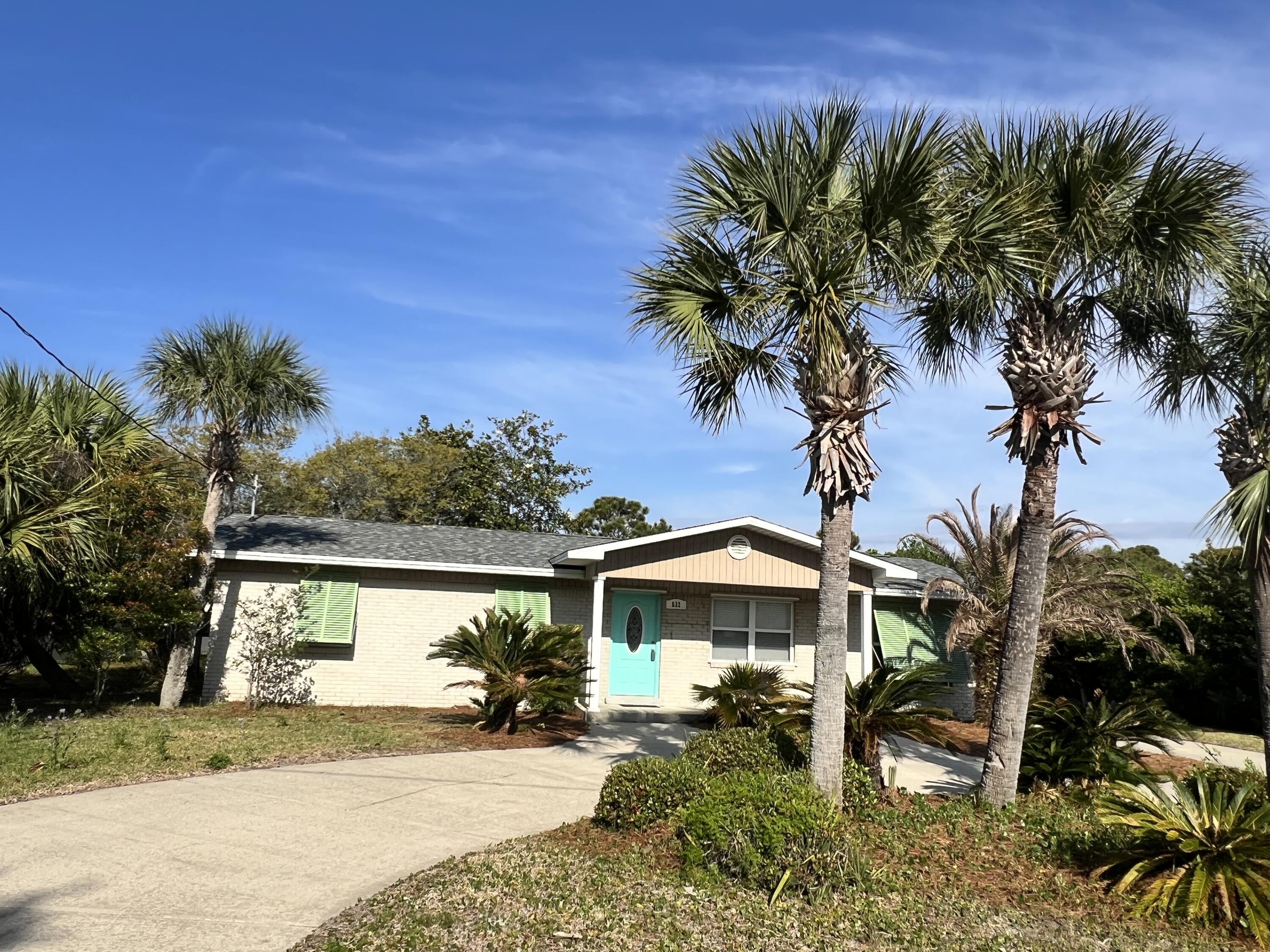 Charming Updated Home on Okaloosa Island - Move-In Ready! Enjoy easy beach access just outside your door--only a brief stroll away. Discover your perfect beach retreat in this beautifully updated 3-bedroom, 3-bathroom home, With tile flooring throughout (no carpet!), this home is both stylish and easy to maintain. The spacious living room seamlessly connects to the eat-in kitchen, featuring solid wood cabinets, granite countertops, stainless steel appliances, and a breakfast bar. The thoughtfully designed split floor plan provides a private bathroom for each bedroom, ensuring comfort and convenience for everyone. A bonus office with French doors is located off the living room and can easily serve as a 4th bedroom! The primary suite is generously sized, with a 5x8 walk-in closet and an elegant ensuite bath, complete with a vanity sitting area, granite countertops, and a tiled, glass-enclosed shower. One guest bedroom has its own private bathroom with a tiled shower, while the third bath features a tub/shower combo, granite countertops, and a modern vessel sink. Step out the back door and take advantage of one of seven Okaloosa Island Water Access pathways, giving residents easy access to both the Bay and the Gulf - less than half a mile away! Additional highlights: Newer, Vinyl Windows, Hurricane Shutters, Brand-new roof in early 2024; Sprinkler System with Lawn Pump; 50-amp RV hookup next to the extra-long driveway -perfect for travelers; The Screened-in porch extends your living space, offering a peaceful spot to relax. Spacious, level backyard with direct access to the walking path leading to the Gulf and Sound. Please note that NO short-term rentals are allowed for Okaloosa Island single-family detached homes so you can enjoy a quiet, residential neighborhood! All appliances included (with the option to purchase select furnishings). You own the land! Unlike some Okaloosa Island properties, this home is not leasehold. Be sure to check out the virtual tour in the photos section. Don't miss your chance to own this incredible home! Call today to schedule a showing!