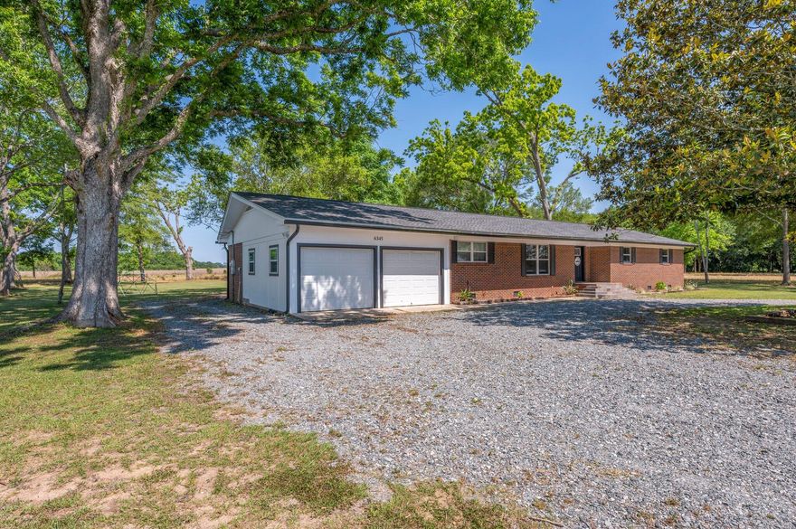 Here is a rare FIVE BEDROOM opportunity plus two bathrooms. This home has been renovated to include so much that is NEW! NEW! NEW! All of the new includes the dimensional roof, water heater, HVAC System, Duct work, tile flooring and wiring. The living room and bedrooms have gorgeous restored original hardwood floors and there is not one stitch of carpet in the home. The drive up to the home is beautiful with farm lands surrounding the home, the driving onto the property is a breeze with the huge circular driveway allowing for two access points from the main road. All of this and it sits on an acre and a half! Do not let this home pass you by!