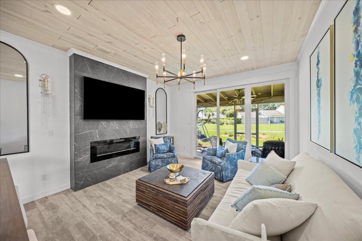 RARE 4-bedroom end-unit in Bayou Village at the entrance of Sandestin Resort. This turnkey retreat has been COMPLETELY remodeled featuring new flooring, designer lighting, upgraded bathrooms, and a fully renovated kitchen with quartz counters, soft-close cabinetry, stainless appliances, and a breakfast island. Enjoy the charm of wood-accent ceilings, a cozy fireplace, a private screened-in porch, and spacious upstairs balcony overlooking the resort. Light-filled living spaces flow seamlessly, accentuated by wood accents and refined decor. The screened-in porch offers a peaceful escape after a day on the beach. Owners enjoy full access to the Sandestin lifestyle, including golf, tennis, shopping, dining, and the bayfront marina.
