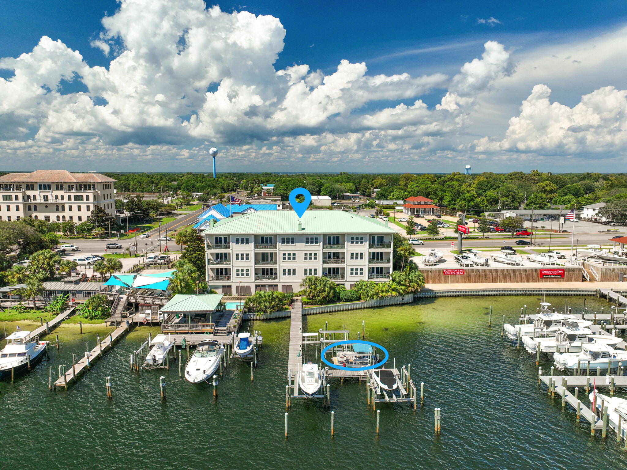 Welcome to Tranquil Harbor, where luxury living meets the heart of Destin's boating paradise. This beautifully decorated 3-bedroom, 3-bathroom unit offers 1,771 sq ft of open living space filled with natural light and sweeping panoramic views of Destin Harbor.Step inside to find a modern coastal, open-concept design with floor-to-ceiling windows that capture both sunrise and sunset. The spacious kitchen flows seamlessly into the living and dining areas, perfect for entertaining with the harbor as your backdrop.The primary suite features access to the balcony, spa-like bathroom, and walk-in closet. Each guest bedroom offers privacy and comfort, making this the perfect retreat for full-time living or a coastal getaway.Boaters will love the deeded slip with a lift! Community amenities include a harbor front pool, BBQ and picnic pavilion, dock access, and marina, all within a secure and private setting. Located just minutes from Destin's best dining, beaches, and entertainment, this condo offers the perfect blend of waterfront lifestyle and modern comfort.