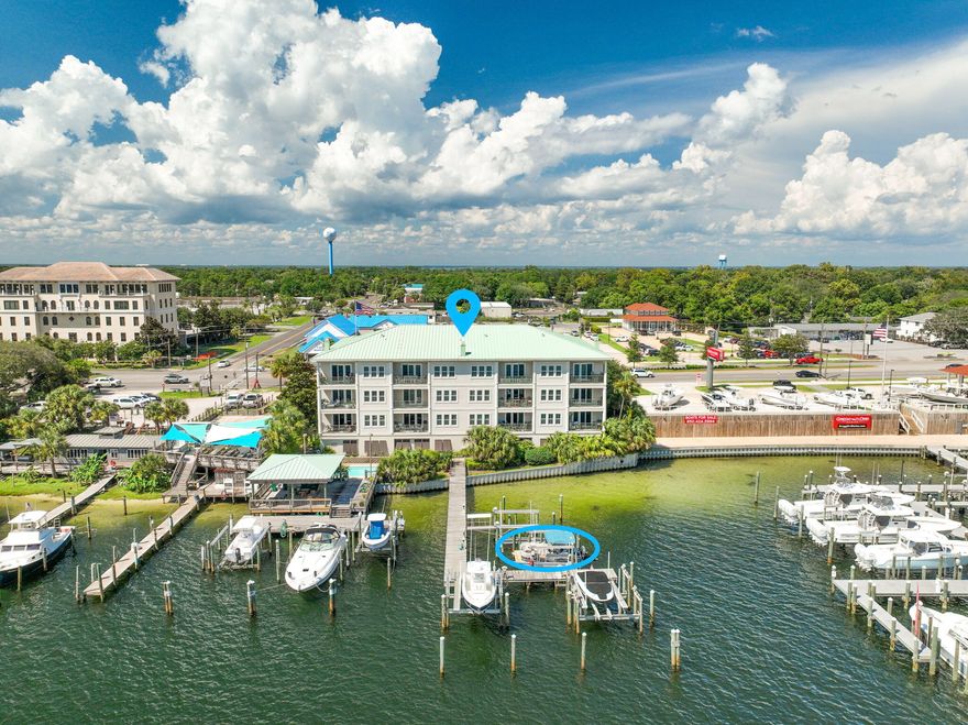 Welcome to Tranquil Harbor, where luxury living meets the heart of Destin's boating paradise. This beautifully decorated 3-bedroom, 3-bathroom unit offers 1,771 sq ft of open living space filled with natural light and sweeping panoramic views of Destin Harbor.Step inside to find a modern coastal, open-concept design with floor-to-ceiling windows that capture both sunrise and sunset. The spacious kitchen flows seamlessly into the living and dining areas, perfect for entertaining with the harbor as your backdrop.The primary suite features access to the balcony, spa-like bathroom, and walk-in closet. Each guest bedroom offers privacy and comfort, making this the perfect retreat for full-time living or a coastal getaway.Boaters will love the deeded slip with a lift! Community amenities include a harbor front pool, BBQ and picnic pavilion, dock access, and marina, all within a private setting. Located just minutes from Destin's best dining, beaches, and entertainment, this condo offers the perfect blend of waterfront lifestyle and modern comfort.