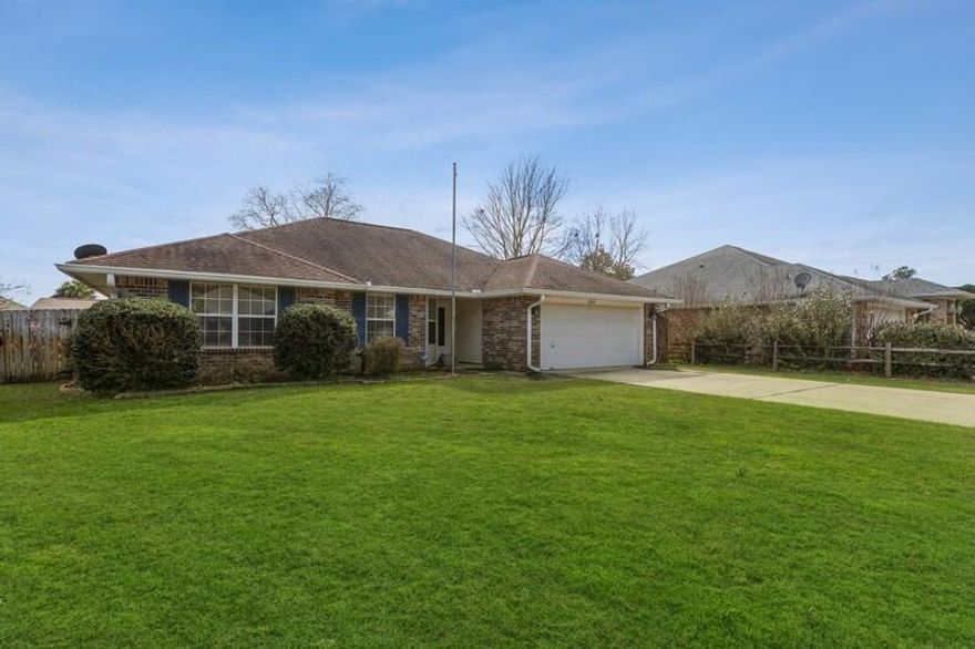 BACK ON MARKET WITH NO FAULT TO SELLER! Seller will replace HVAC and payoff solar panels. This well maintained all brick home is located minutes from Hurlbert Field and Shopping. This 3-bedroom, 2-Bathroom Contemporary style home is completely carpet free. The bedrooms are very spacious, and the kitchen is fully equipped with all stainless-steel appliances and lots of cabinet space. Fully fence back yard with privacy fence and a covered patio.