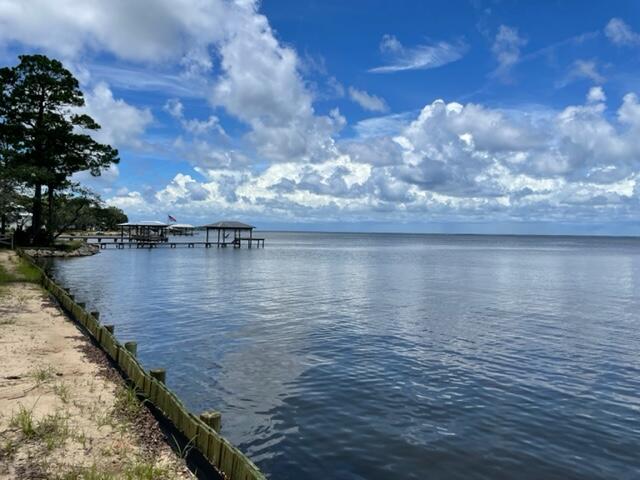 Seller is in the process of completing a lot split. Lot will be approximately 90 feet on the bay and 200 feet deep. Lot is secluded, wooded and has endless possibilities. Seawall already in place. Lot is ready for you to build your dream home and enjoy the sunsets and all that living on the bay has to offer.