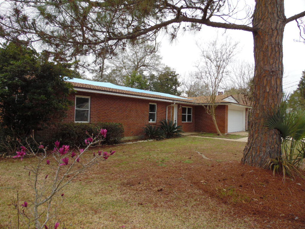 Great location to build your dream home.This beautiful 3 bedroom, 2 bath brick home with a nice size fenced back yard and 2 car garage was damaged in a fire. The location is close to all that Ft Walton Beach has to offer; shopping, restaurants, beaches, schools and employment opportunities.