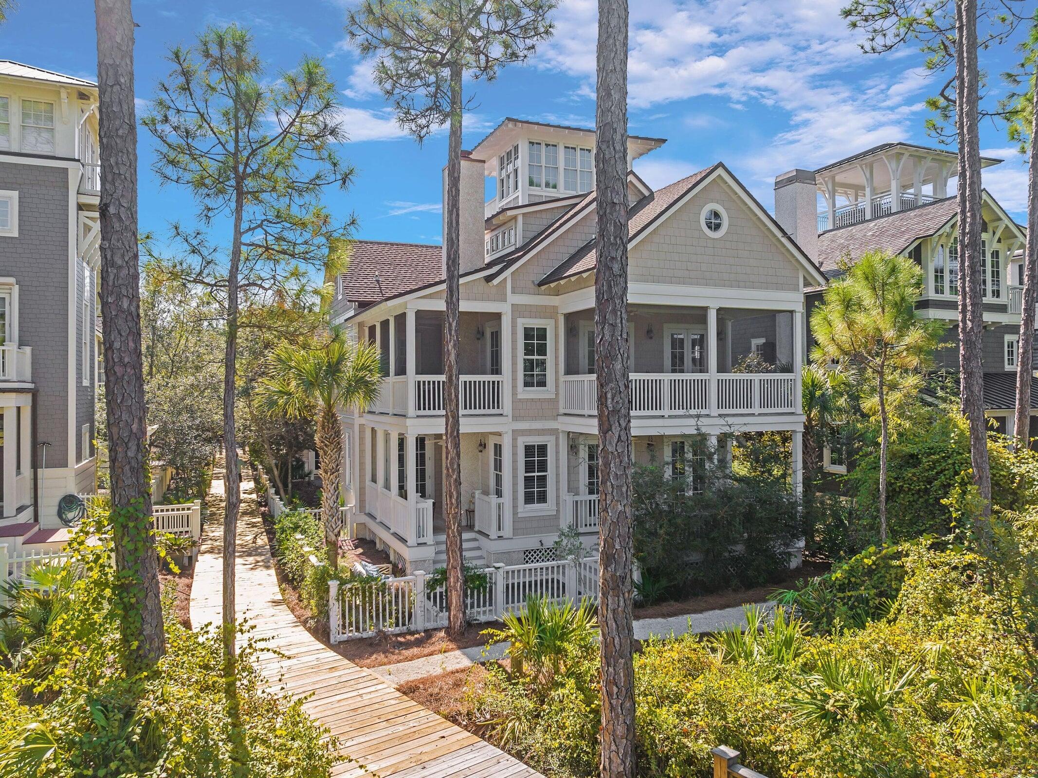 This magnificent custom-built residence sits within the prestigious Gulf-front enclave of WaterSound, offering unparalleled luxury across four impeccably designed floors. At the pinnacle lies the lookout tower, a serene retreat to savor breathtaking panoramic views of the Gulf during sunset. Ideal for hosting, the home boasts multiple screened porches on each level, seamlessly blending indoor and outdoor living. A refreshing Jacuzzi pool awaits, complemented by a separate carriage house atop a two-car garage.The interior exudes warmth with heart-of-pine flooring and shiplap accents, harmonizing with the natural surroundings. You are just a short walk to the gorgeous beach and the neighborhood pool!