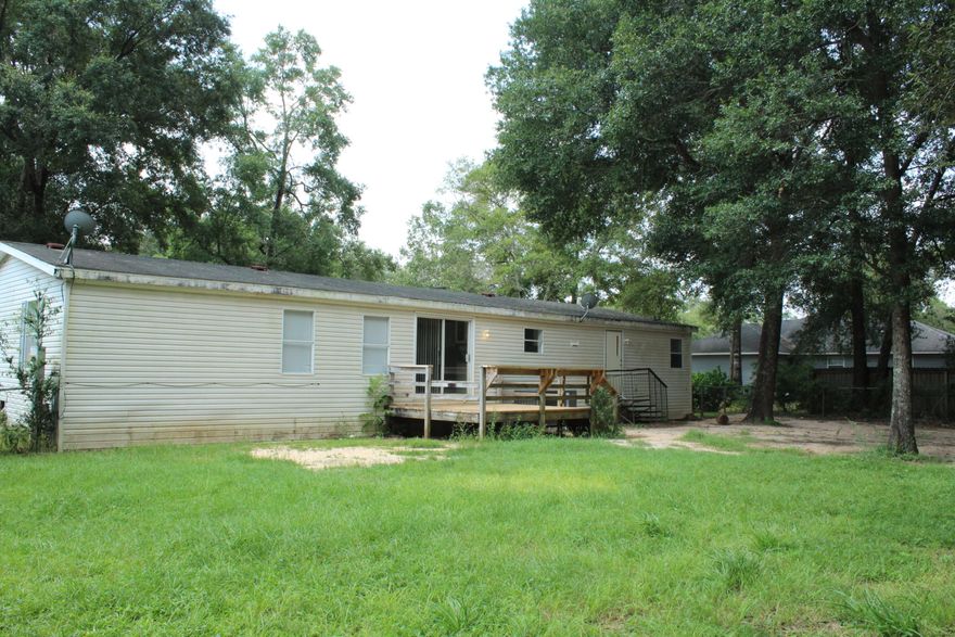 Back On Market with Kick Out Clause!!! Accepting Back Up offers! Great 4 bedroom and 2 bath home with 1782 sq ft located in Milton FL. This home is in a very nice subdivision that is an easy drive to restaurants, shops, schools, and churches! The home features two large family rooms! The kitchen opens to both living rooms and has a peninsula that seats 2. There is a good sized laundry off the kitchen that also opens to the back yard! The kitchen overlooks the backyard and open deck! There is a sliding glass door to the deck! Also there is a wood deck on the front of the home. The master bedroom has an ensuite bathroom with a soaking tub, walk in shower, and double vanity.  Buyer to verify all dimensions and information.