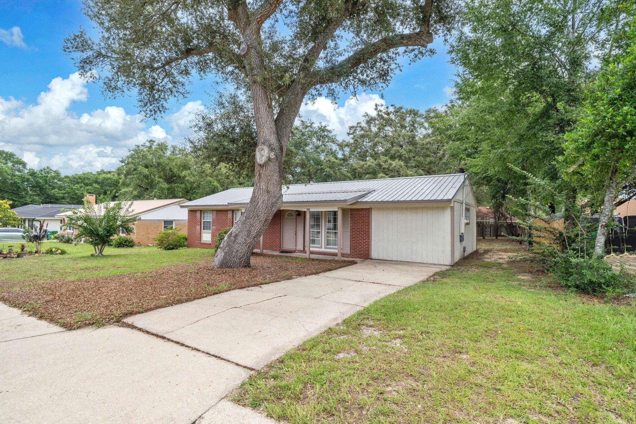 Adorable 3 bedroom and 1 bath home with 1350 sq feet centrally located in Niceville, FL. This community some of the best schools in the State of Florida! Insurance will not be an issue! The roof and HVAC were replaced in 2023 and the water heater was replaced in 2022. This home has new flooring, paint, and light fixtures. The kitchen has updated countertops, a white refrigerator 2023, white slide in oven and stove 2023, and a dishwasher. There is also a separate heated and cooled laundry room. The back yard is large and partially fenced. This home is in a perfect location in Niceville and is close to shopping, restaurants, churches, and schools. Buyer to verify all dimensions and information.