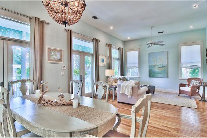 Cool Caribbean colors adorn this charming Frangista Beach home, cozied behind a white picket fence fewer than 200 yards from neighborhood beach access. Only one home to the east separates it from the secluded neighborhood pool, practically placing it in the back yard. An over sized front porch with a place for hanging swing is shroud in lush, tropical landscaping. Three sets of French doors with large transom windows reveal hardwood floors that carry from the open living and dining room areas into its three bedrooms, as well as renovated and professionally decorated interiors. Privately tucked at the rear of the home, the master bedroom features French doors that lead outside onto a private deck with shade pergola.  Steps from Community Pool.