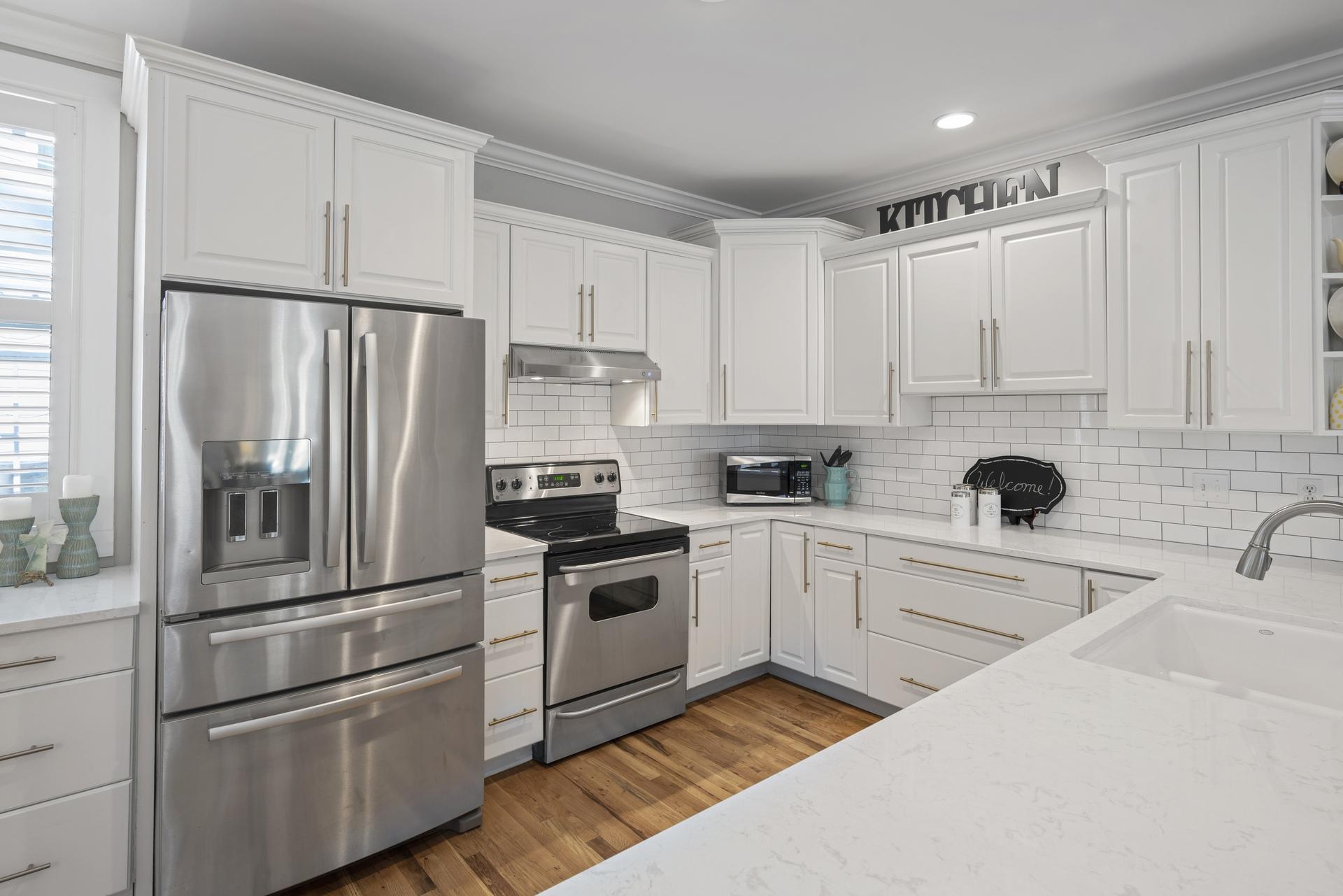 Wonderful opportunity to own a beautiful 5 bedroom/4 bath home in popular Grove by the Sea in Seagrove.  This spacious family home boasts hardwood floors throughout, gorgeous remodeled kitchen, built-in cabinets/shelving in great room, and the perfect floor plan for visiting family and friends.  The lovely master suite is on the first level and features a walk-in closet and a luxurious master bath boasting carrera marble and beautiful soaking tub.  There is also another bedroom suite on the main level with updated bath, custom built in bunks along with a queen bed, and adjoining study with a built-in daybed.  The second level contains two large bedroom suites with french doors leading out to a lovely screened porch.  There is also a adorable playroom for the grandkids!