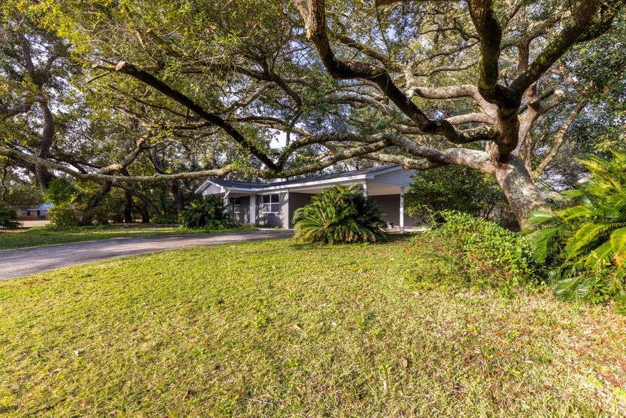 Beautiful fully remodeled home with new effective year built of 2015! This all brick home is sure to impress with NEW interior and exterior paint, copper wiring, plumbing, insulation, windows, Rinnai tankless water heater, Lifeproof LVP flooring, and recessed LED lighting throughout. NEW roof installed December 2021! The nook featuring shiplap walls in the foyer is the perfect entry piece to this charming home. The kitchen comes equipped with stainless steel appliances, quartz countertops, and custom built soft close cabinetry. Both bathrooms feature under cabinet motion activated toe-lighting, tiled showers, and double vanity quartz countertops. The unique trees provide tons of privacy on a large corner lot in the in the heart of Fort Walton Beach. Centrally located near Hurlburt and