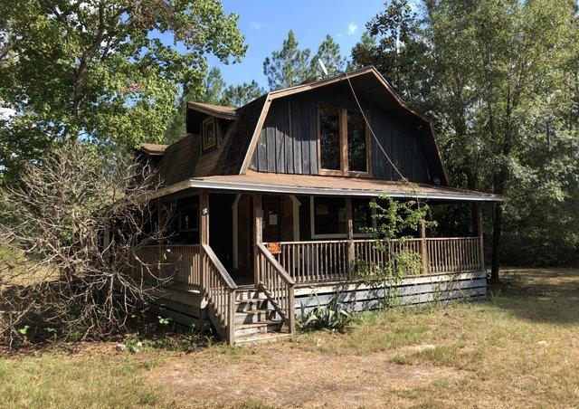REO. Large 4.77 Acre parcel just east of Freeport. The parcel has a 1 Bd / 1 Ba home with loft in need of some TLC & would make a great getaway. There was previously a mobile home on the property that has since been removed so there are utilities for mobile home. The parcel is just minutes to Windswept Golf Course & to Publix. Come be a part of the fast growing Freeport! The subject is in an online real estate auction. All offers must be submitted through the auction website XOME.COM. This property is subject to a 5% buyer's premium pursuant to the Auction Terms & Conditions (minimums may apply). All auction assets will be sold subject to seller approval.