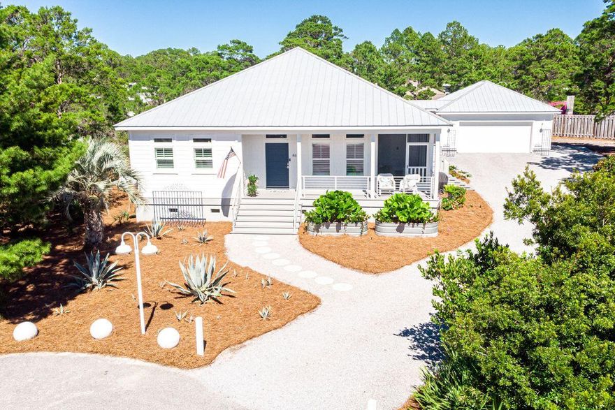 Presenting the perfect single level home at the beach! Situated on 0.4 acres with room for a pool or more interior space, the current coastal architecture and décor is sure to please. Built in 2015, this 3 bedroom, 2 baths, 2 half baths cottage with shiplap walls and bright interior has a terrific layout. A plethora of custom-built cabinetry provides storage, and an office space makes for ideal extended stays or full time living. The great room features natural light streaming from several directions and the well thought out kitchen will please the family cook. Porches on 3 sides with swings invite you to enjoy the breezes and green space all around. The home is complete with impact glass deep, gas powered appliances, and a whole house generator. Additional perks are No HOA fees, Flood Zone X status, and a survey is available. Currently a primary residence and furnishings will not convey.