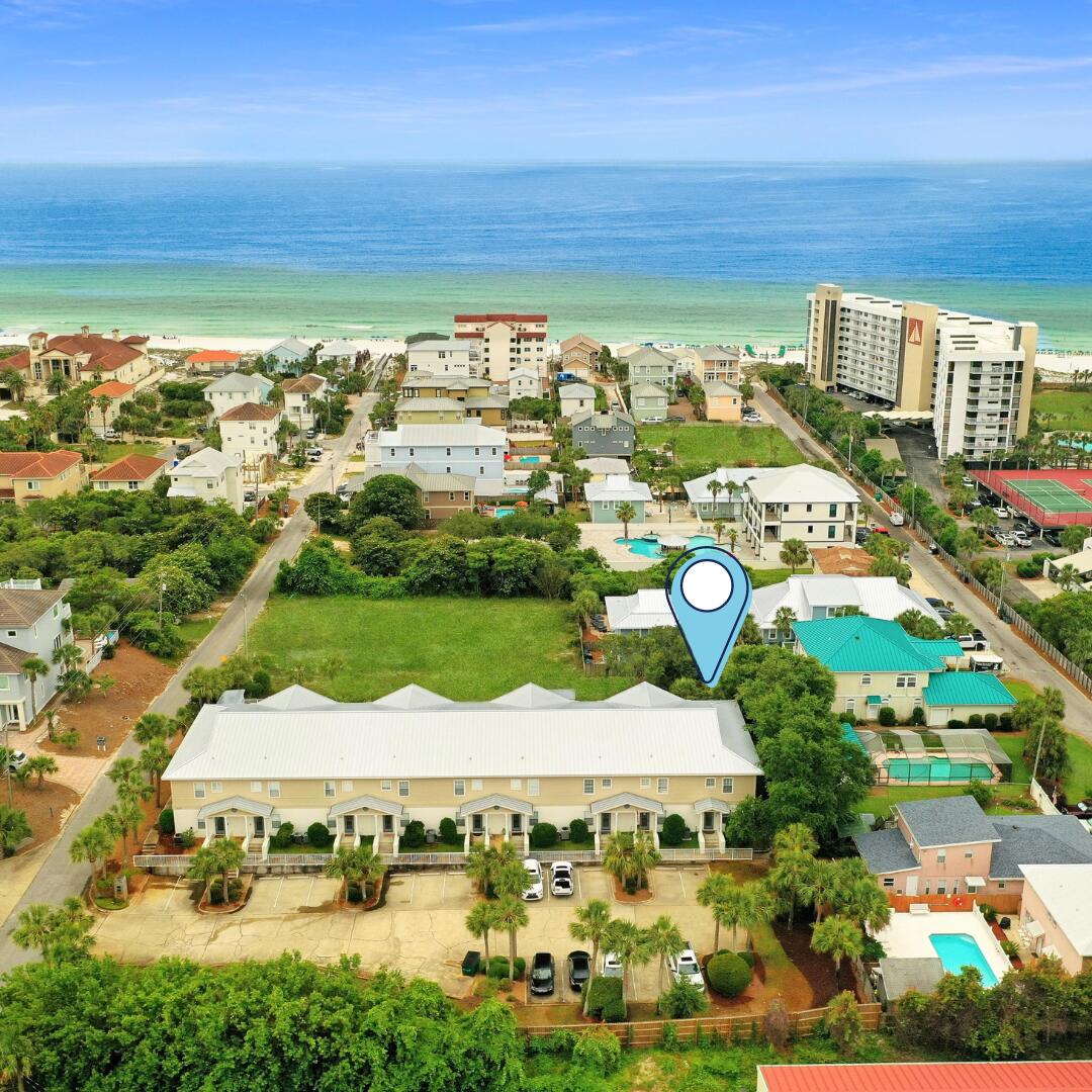 MUST SEE! Gulf of Mexico glimpses from the upstairs balcony and only 200 yards to the public beach walkover. This property can be used as a full time home, second home or a vacation rental though, to date, it has NEVER been rented. There are only 9 units in the complex and this one is on the far end away from the street. In October 2020 the entire building, doors & railings were painted & waterproofed; the complex just had a new roof installed in 2021 and have plans to re-work the landscaping and refurbish the pool. There is money left in reserves for these next two projects. All owners have 2 assigned parking spaces. This unit has had a complete renovation in the past 4 years - Check the document section for the full list. This unit will come fully furnished less the artwork & photos.