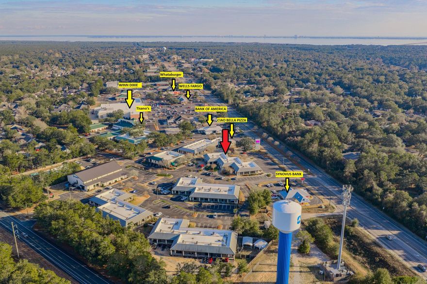 HIGH VISIBILITY & EASY ACCESSIBILITY. Prime CLASS A office space in popular Merchant's Walk business complex in the heart of Bluewater Bay. Located in one of the busiest & most popular complexes in BWB with direct frontage on Hwy 20, this 750 SF commercial space provides maximum drive-by traffic & visibility.The current floor plan consists of a large reception & waiting area, 3 offices, 1 flex space area & 1 bathroom. Newer roof & HVAC provide peace of mind.