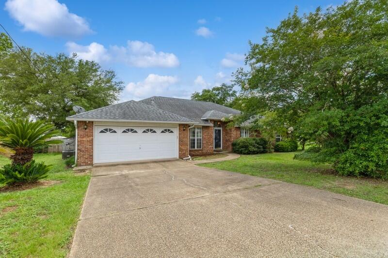 Large SOUTH Crestview corner lot home with easy access to military bases and beaches. With a split-bedroom floorplan, it has 4 bedrooms, but an extra office/bonus room is included! The beautiful kitchen boasts granite counters with an amazing backsplash, soft close drawers, and stainless-steel appliances. The roomy master suite has a walk-in closet that will be hard to fill. The corner lot gives you many options for your backyard, but you will already have a 12x24 covered patio, a storage shed, and a double gate, perfect for an RV or boat. HVAC - 2017, Roof will be replaced with an acceptable offer. Make this YOUR next home!