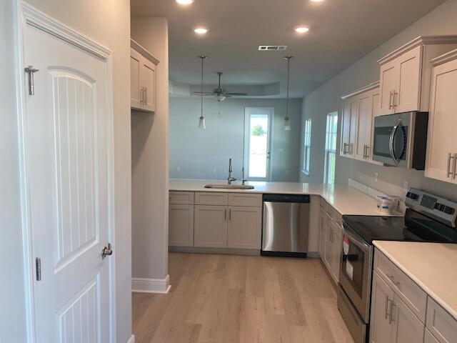 Limited time offer: Receive up to $25,000 Flex Cash! Use it towards options, interest rate buy-down and any combination of HOA fees, prepaids and closing costs with our preferred lenders. THE BLUFFS is a new Freeport subdivision located 3 miles north of the intersection of Hwy 20 and Hwy 331, just a 20 minute drive to South Walton beaches! Craftsman style, 3 BR/2 BA. Interior features 9' ceilings throughout, 10' trey ceilings in the Living Room + M.Bedroom. Bay windows provide a sunny dining room. 8' entry doors, quartz countertops + durable & stylish LVP flooring throughout; no carpet. Sprinklers w/well + pump, fully sodded yard, garage door opener, total electric.