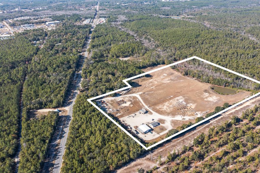 Prime 25.84+/- Acre Mixed-Use Opportunity in Growing Freeport, FloridaPositioned in the rapidly developing community of Eastern Freeport, this expansive 25.84+/- acre parcel offers exceptional flexibility for investors, builders, and end-users. Located just off Highway 20 East--with access via a 55+/- foot ingress/egress easement--this property combines strategic location, valuable zoning diversity, and existing improvements to support a wide range of future uses.Approximately 75% of the land features average elevation and has been partially excavated for fill dirt, offering a head start for construction or site development. The northern 25% includes a natural low/pond area, adding potential for creative site planning or environmental integration. Public utilities are available to or near the property.

Zoning classifications include I-1 (Light Industrial), R-2 (Medium Density Residential), and SDD (Special Development District), providing rare versatility for industrial, residential, or mixed-use development.

Built in 2021 and in good condition, existing improvements include:

1,280?? sq. ft. office building

3,000?? sq. ft. warehouse with attached shed

Dirt drive access

Underground electrical service

Private well and septic system

Whether you're seeking a light industrial site with existing infrastructure, a residential development opportunity, or a mixed-use project in a thriving Walton County market, this property delivers unmatched potential.