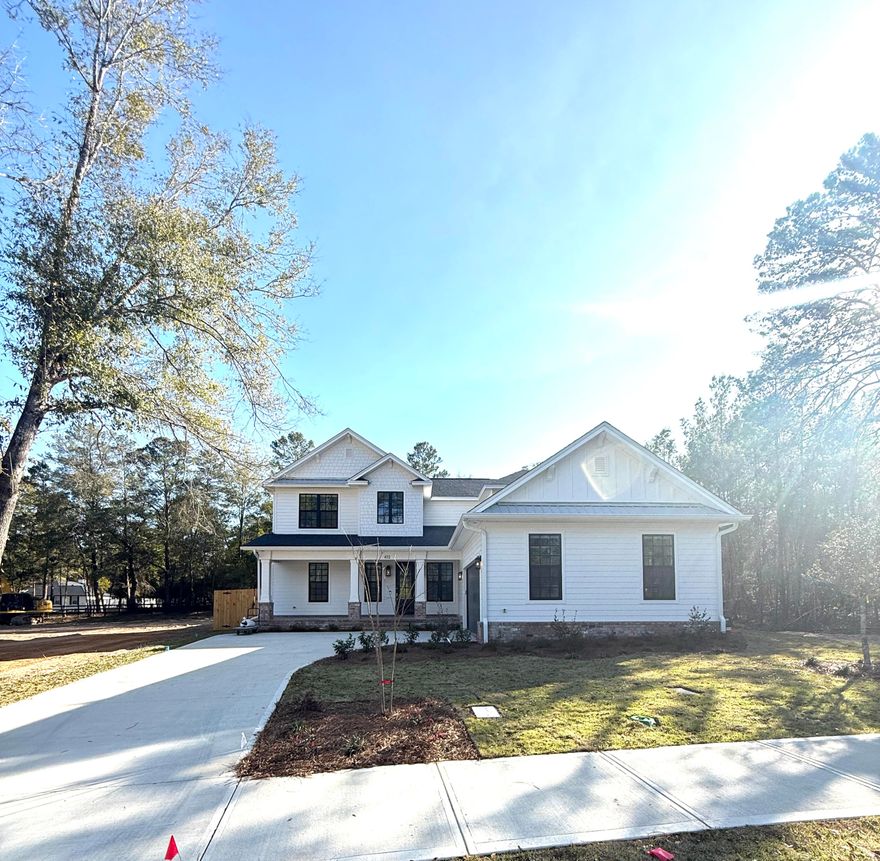 Step into refined elegance in this exceptional 5-bedroom, 3.5-bath luxury residence located in the highly coveted Deer Moss Creek community. Thoughtfully designed across two stories, this home offers a private primary suite on the main level, complete with direct access to the lanai--creating a seamless indoor-outdoor retreat.The primary bathroom rivals a high-end spa, featuring a statement chandelier, dual vanities, a spacious walk-in shower, a freestanding soaking tub, and an expansive custom closet with rich wood shelving. Upon entry, custom French barn doors frame a sophisticated dining or flex space, ideal for formal entertaining or an elegant home office.The open-concept living area is anchored by a gas fireplace with natural stone surround and beautiful mantel, setting a warm...yet luxurious ambiance. At the center of the home, the chef's kitchen impresses with white shaker cabinetry with soft-close detailing, quartz countertops, a gas cooktop, stainless steel appliances, a pot filler, farmhouse sink, and an oversized island designed for both beauty and function.
Every detail of this home reflects timeless style and modern comfort, offering generous living spaces, upscale finishes, and an enviable location in one of the area's most desirable neighborhoods. A rare opportunity to own a home where luxury, comfort, and design converge.
