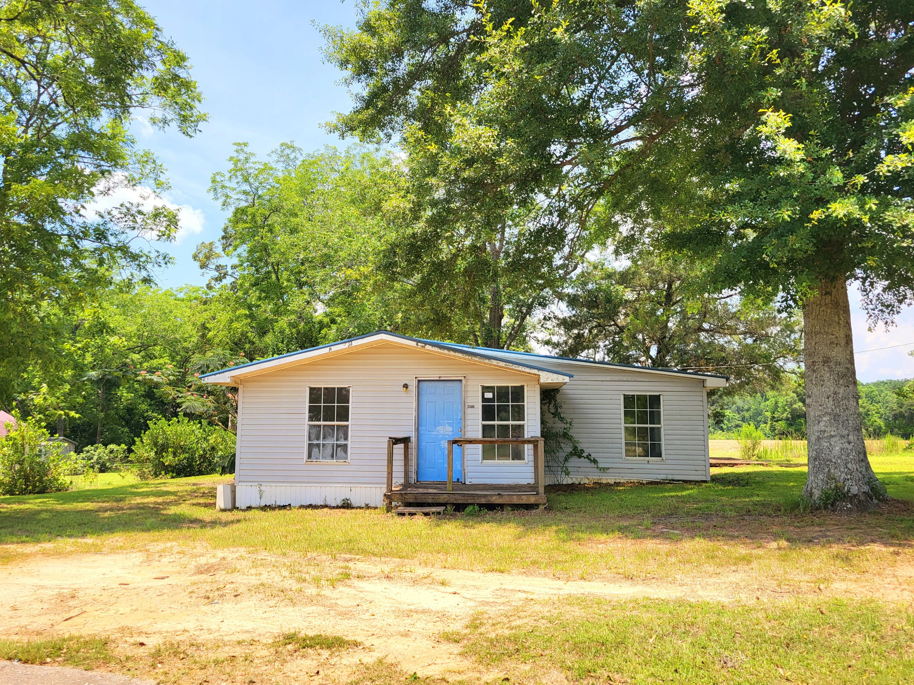 Discover your own oasis of serenity in this charming 3 bedroom, 2 bathroom residence, nestled on nearly a quarter-acre lot. Enjoy breathtaking panoramic views from the front and back of the house, along with the convenience of well water. Built in 1961, this home offers a tranquil escape with no HOA fees in a prime location. Roll up your sleeves and come turn this blank slate into your dream country home.
