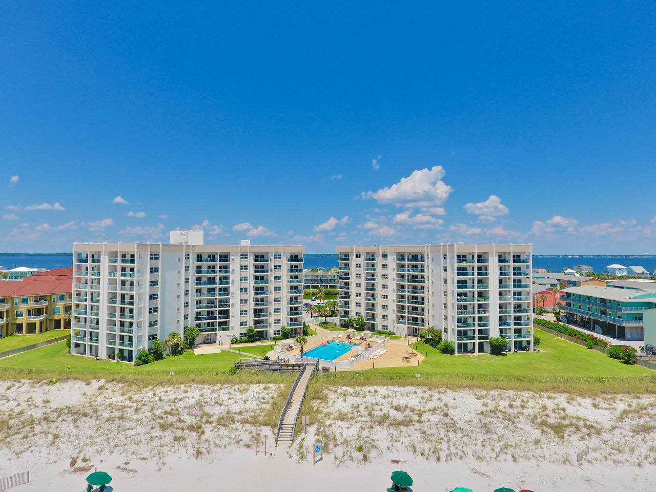 GULF FRONT! The Perfect Gulf Front condo is turn key ready for you and your guests. Updated with tiled floors through out, kitchen with Granite counter tops, updated cabinets and appliances. The bedroom offers attached bathroom, walk in closet and plenty of natural light. The open floor plan living and dining area offers plenty of space to spread out and tons of natural light with sliding glass doors leading to the outdoor patio. This ground floor unit gives you perfect access to the green space right off the patio, the community pool, the beach with no stairs or elevators to deal with. The community offers tennis courts, workout room, community room and Gulf front community pool . Priced to sell this condo will not be around long. Additional interior pictures to follow soon.