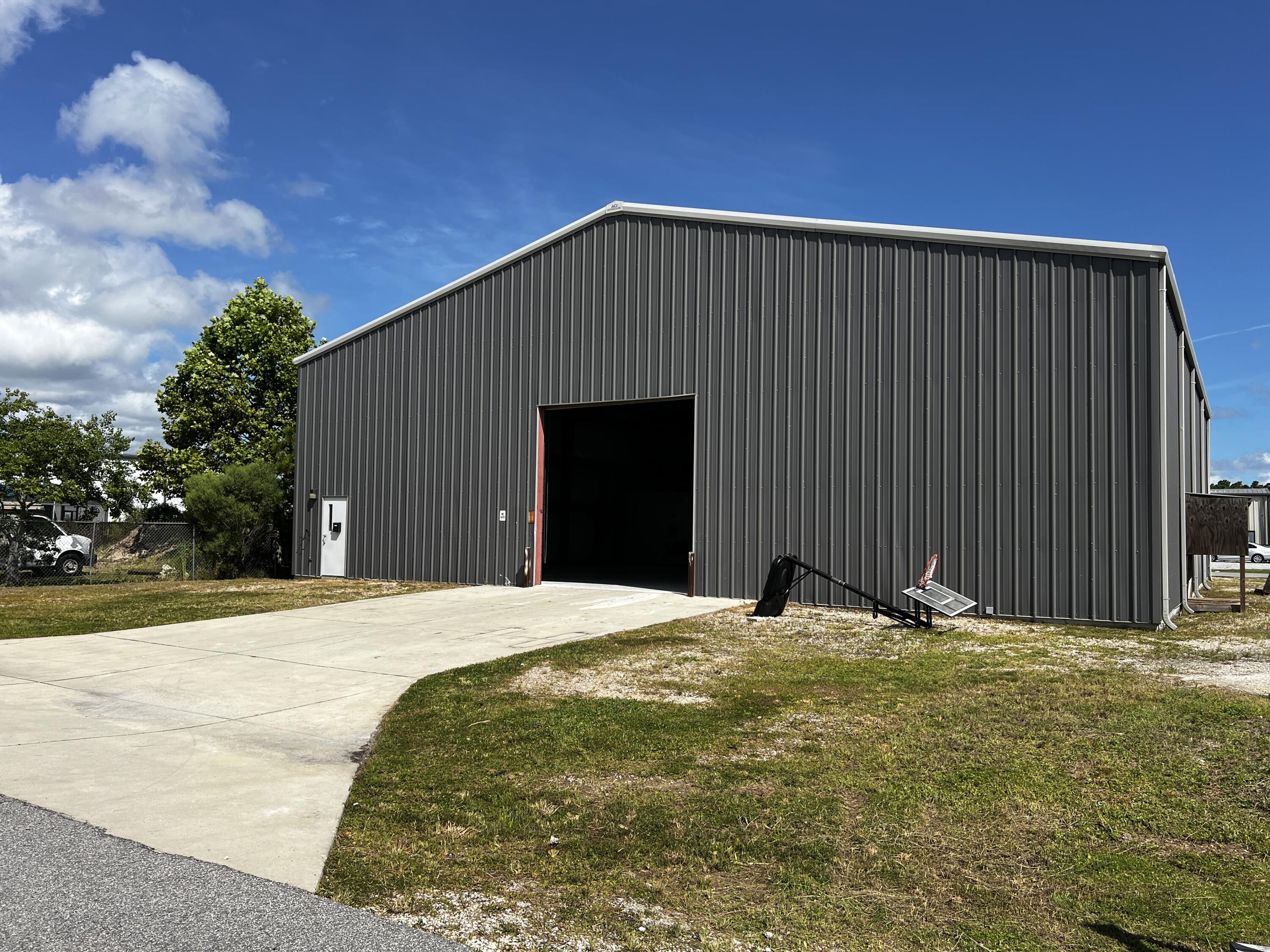 5,600 Sq. Ft. warehouse on Holley Circle. The building includes two 12' x 12' street-level rollup doors on either side of the building, which provides easy access and drive-through capabilities. 20' clear-height at the eaves and 26' clear on center. +/-400 sq. ft. office. Zoned C-4, Research & Design within unincorporated Bay County, which is effectively 'light-industrial'. Located less than one-mile to the Navy Base.