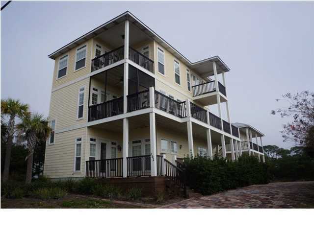 BANK OWNED WITH EXSPANSIVE GULF VIEWS east to west from all 3 floors and NO HOA DUES!!! Designed as the perfect beach property with large living spaces on each floor, 10 foot ceilings, crown molding, upscale finishes, and sizeable closets. The main house features 6 bedrooms / 5 baths and the carriage house has 2 bedrooms / 1 bath. Premium quality construction with new building codes, bolted from the roof to the foundation, and comes with hurricane rated windows and doors. Main house 1st floor has 3 bedrooms, 2 baths, comfortable living area with full wet bar. 2nd floor has the great room and kitchen with 1 bedroom / 1 bathroom. The gourmet kitchen is equipped with commercial style DCS six-burner gas range, griddle, double ovens, two dishwashers, icemaker, and large