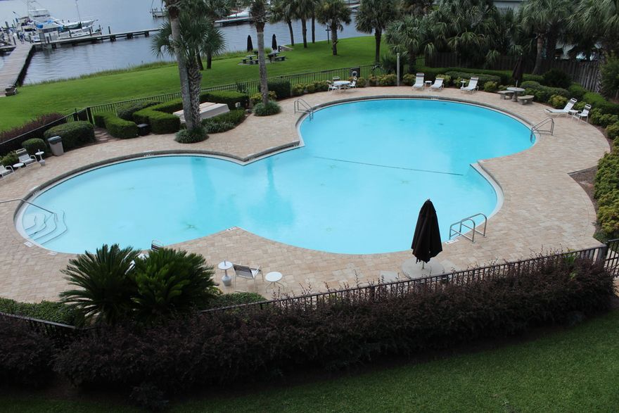 A fantastic 3rd Floor Waterfront Studio Condo having a VERY LARGE 46ft, Boat Slip Assigned, Slip #A08. Nicely updated, and furnished, move-in ready for your personal or family use. OR, use it as a second home, and rent it out when not using it personally. The Complex amenities are: Two Super Large Fantastic Pools; BBQ Grills & Picnic areas; Marina/Docks with your own Assigned Boat Slip.. and walk the Docks for exercise, or feel free to fish (with an appropriate License); Close to Restaurants, the Mall, the Beach, and more.. All within very few minutes. Rather hard to beat the value anywhere in the local areas. Inventory is the lowest it has ever been for a really long time.. Don't procrastinate.. Call today. Oh, by the way, the dues cover the following: Water; Sewage; Trash;