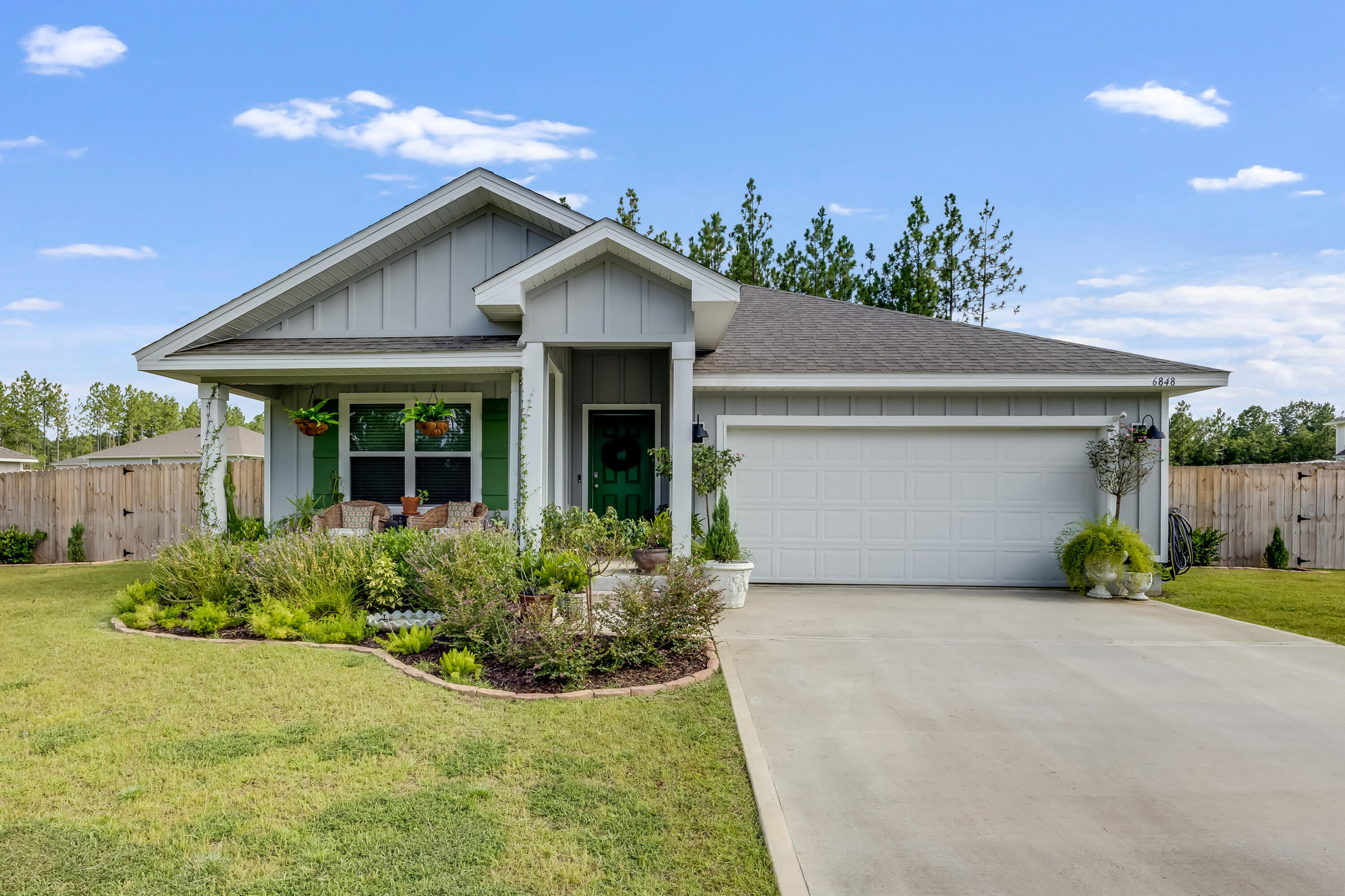 Seller is offering TEN THOUSAND DOLLARS towards closing. Close in September and receive a free 70-inch TV.This stunning home is packed with high-end upgrades inside and out. Beautifully landscaped with custom stonework, garden beds, and a fully fenced yard with multiple gated entries. Enjoy added exterior features like shutters, motion-sensor lighting, and an irrigation system.Inside, thoughtful design touches are everywhere--custom woodworking, barn door, beadboard walls, banquette seating, elegant chandeliers, and upgraded lighting throughout. The kitchen boasts double pantry doors, custom trim work, a glass-front hutch, pull-out drawer, upgraded hardware, and stylish island lighting. Bathrooms feature French Country mirrors, resurfaced shower floor, and coordinated fixtures. Practical upgrades include LVP flooring in select rooms, laundry room built-ins, smart lighting package, smart entry, garage door app control, two garage door openers, tankless water heater, blinds throughout, and pre-wiring for fans and a security system.
Located on a quiet loop with a retention pond in front and a tree-lined backyard buffer, this larger lot offers a flat driveway, 2-car garage with attic access, and neighborhood amenities including a pool and convenient mail center.