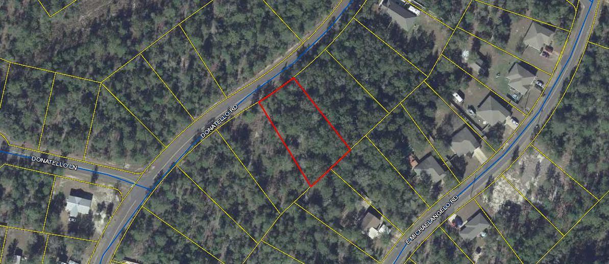 Wooded lot on a paved road located just outside the DeFuniak Springs City Limits. Lot is larger than the average in the area. Public water is available to lot. Perfect for your new home.