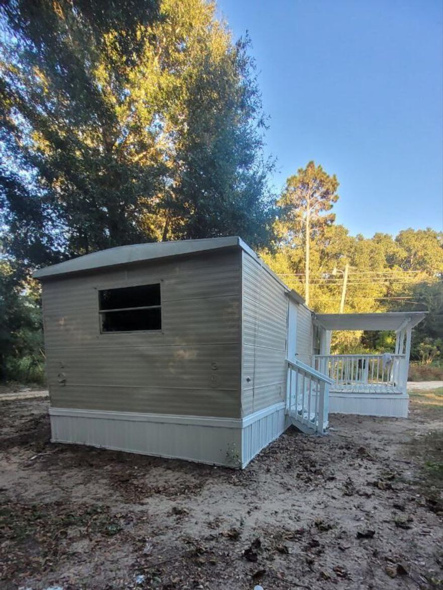 Newly remodeled 3 bedroom mobile home in a quiet park.  Large covered front porch.
Rent includes water and trash. Washer and dryer hookups in the unit.