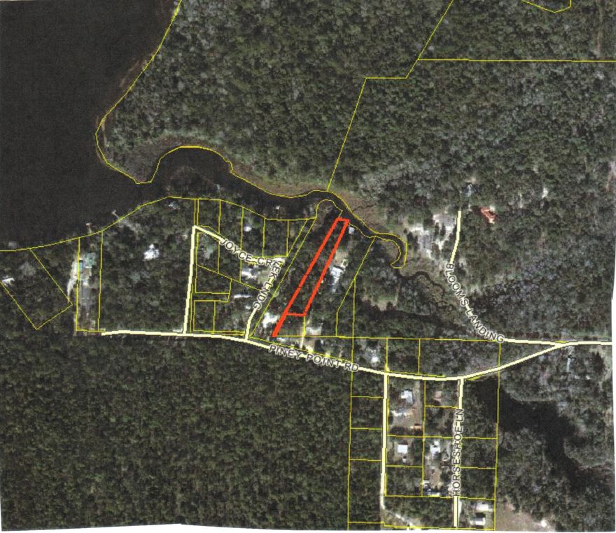 Great larger parcel with Bay access. This wooded property is located on Joyce Creek and is just a short distance to Alaqua Bayou and the Bay. The property has a small cabin that has been given no value, but has water, electric and septic tank. The cabin was used as a fish camp and has not been lived in for several years. The property has very large trees and lots of shade. This is a great property if you are looking for a place to get away or to build a home.