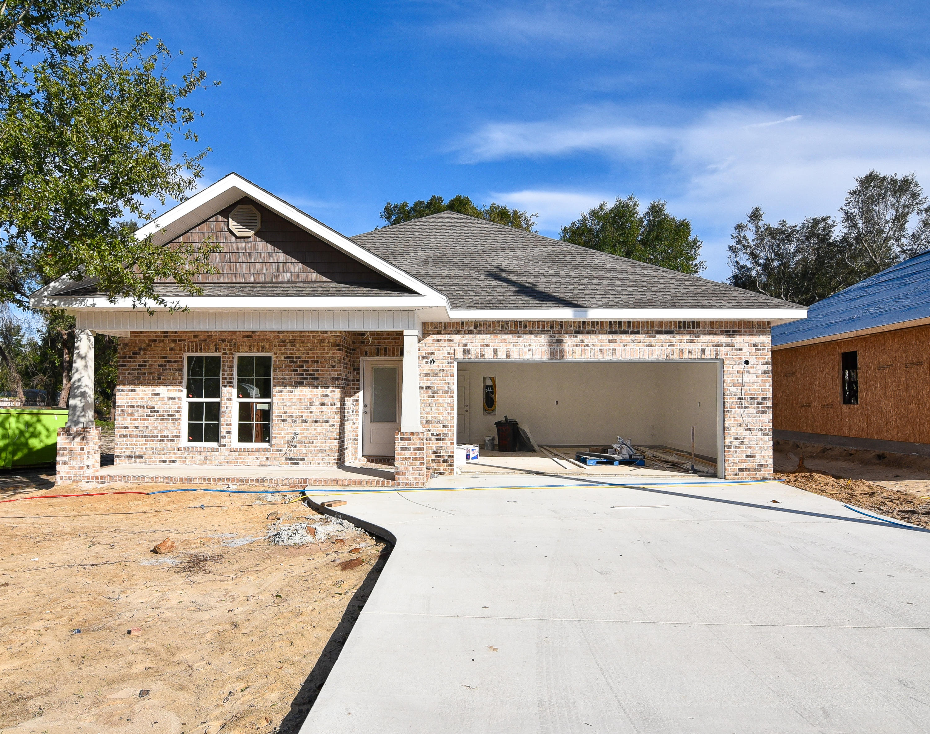 Beautiful 5 bedroom 2.5 bathroom home by a local builder. In the craftsman style, this home offers all the comforts and conveniences of modern living: QUARTZ/GRANITE counter-tops; custom, SOFT-CLOSE, shaker style, all-wood cabinets; SLATE finished GE appliances including a gas stove; tankless hot water heater, large walk-in pantry, and large central island w/ breakfast bar. Main living area(s) solid surface flooring, with tile in the bathrooms & FRIEZE carpeting in the bedrooms. This custom home also includes: 9-11' ceilings, CROWN, tray ceiling, and arched walk-thrus. Note: Pictures are of a home by the same builder with similar finishes & floor plan. Some details depicted may not be exactly the same.