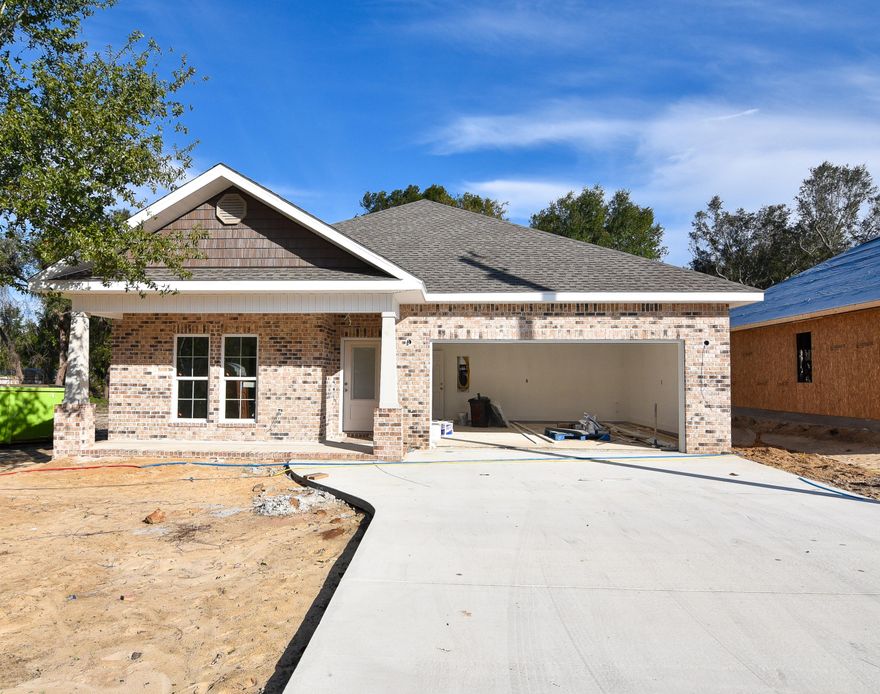 Beautiful 5 bedroom 2.5 bathroom home by a local builder. In the craftsman style, this home offers all the comforts and conveniences of modern living: QUARTZ/GRANITE counter-tops; custom, SOFT-CLOSE, shaker style, all-wood cabinets; SLATE finished GE appliances including a gas stove; tankless hot water heater, large walk-in pantry, and large central island w/ breakfast bar. Main living area(s) solid surface flooring, with tile in the bathrooms & FRIEZE carpeting in the bedrooms. This custom home also includes: 9-11' ceilings, CROWN, tray ceiling, and arched walk-thrus. Note: Pictures are of a home by the same builder with similar finishes & floor plan. Some details depicted may not be exactly the same.