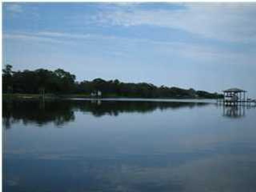 Seller's loss is your gain! Beautiful property for development or personal estate! SELLER WILL CONSIDER OWNER-FINANCING!! Don't miss making an Offer on this beautiful property - motivated seller!! Great reduction! The first page of plan/plat to develop this property is attached to this listing - see photos. 8 lots to be developed on Mallet Bayou. Lots, 1, 2 & 3 are waterfront lots. Lots 8-4 are adjacent interior lots - homes could possibly have water views. Set-backs are 50 feet from the water, 20 feet from the road and 7 1/2 feet from the sides. Rare opportunity for developers with plans provided.