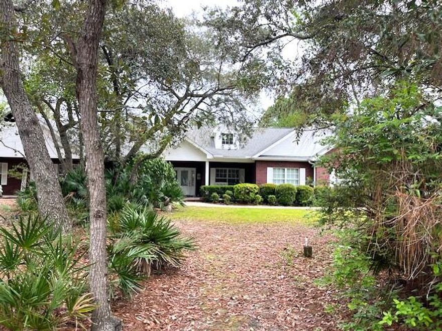 New Pictures Soon! Rare opportunity to own a home in Bluewater Bay area ,Niceville! Privacy level 1.24 acre lot, 1-story home, in-law (or income producing) 1200 sq ft suite! Total 5 bedrms, 3 full & 2 half baths. In-law suite has own entrance or use door between main house & in-law suite to combine sides. In-law suite: 1200 sq ft (living, 1/2 bath, dining, huge kitchen w/granite, large master & bath). Main house: 4 bedrm, 2.5 baths, large bedrms, great rm, kitchen w/granite-stainless steel appliances-gas cooktop, 2 car garage (1/2 finished but can be re-opened). Property offers: privacy, fenced backyard, Heated/cooled storage (could be finished for living unit), extremely large workshop (RV garage), Boat/RV covered parking, and so much more.  Buyer to verify all deemed important info.