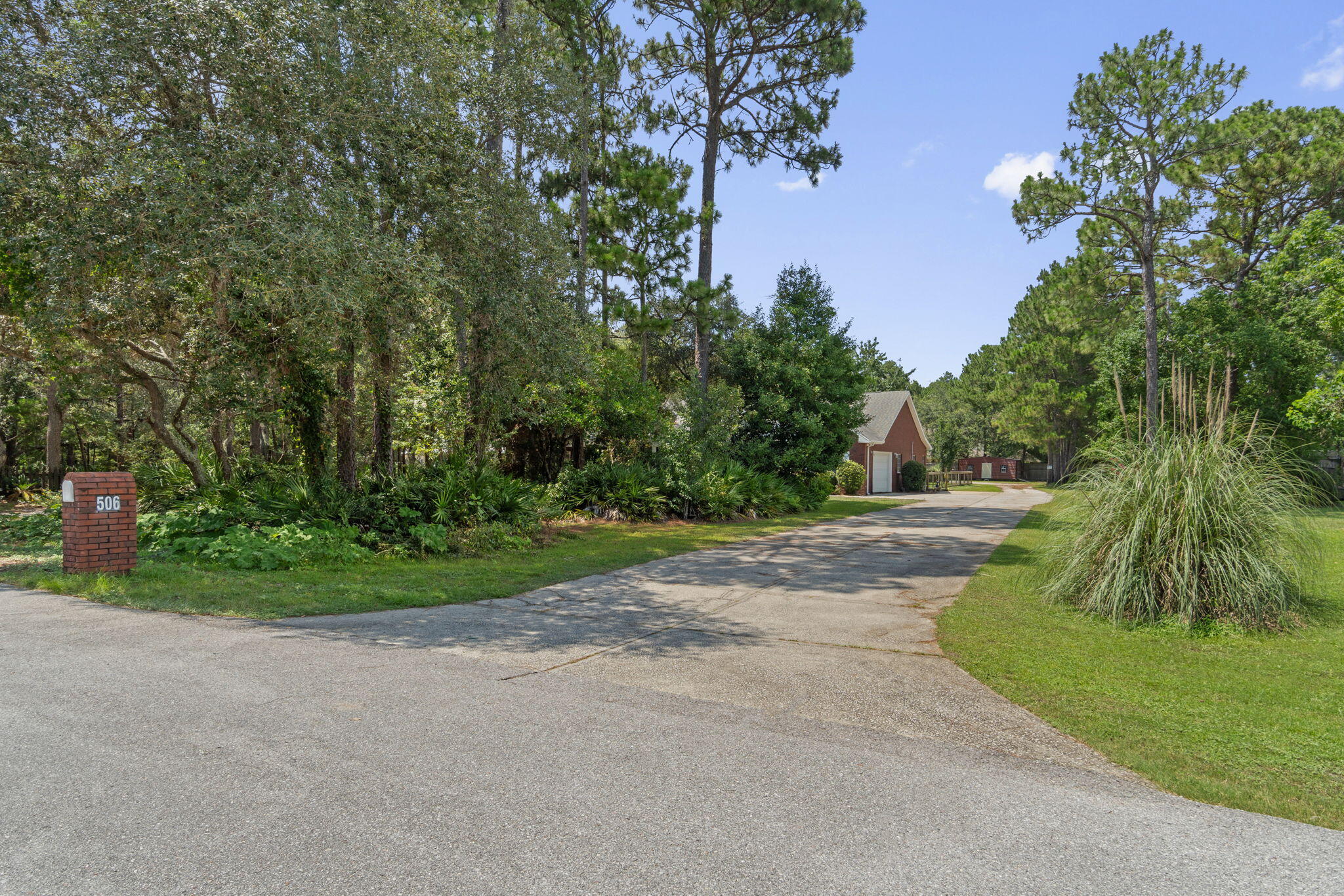 NEW PHOTOS & Virtual Tour! Rare opportunity to own a home in Bluewater Bay area Niceville! Privacy level 1.24 acre lot, 1-story home, in-law (or income producing) 1200 sq ft suite! Total 5 bedrms, 3 full & 2 half baths. In-law suite has own entrance or use door between main house & in-law suite to combine sides. In-law suite: 1200 sq ft (living, 1/2 bath, dining, huge kitchen w/granite, large master & bath). Main house: 4 bedrm, 2.5 baths, large bedrms, great rm, kitchen w/granite-stainless steel appliances-gas cooktop, 2 car garage (1/2 finished but can be re-opened). Property offers: privacy, fenced backyard, Heated/cooled storage (could be finished for living unit), extremely large workshop (RV garage), Boat/RV covered parking, & much more. Buyer to verify all deemed important inf